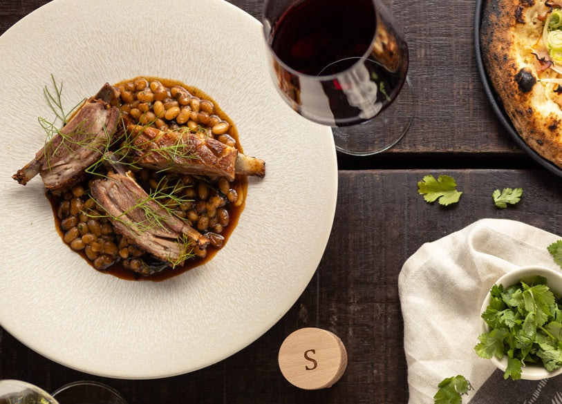 Recipe for Slow Roasted Lamb Ribs with Braised Kale, White Beans, Capers and Parsley Pesto